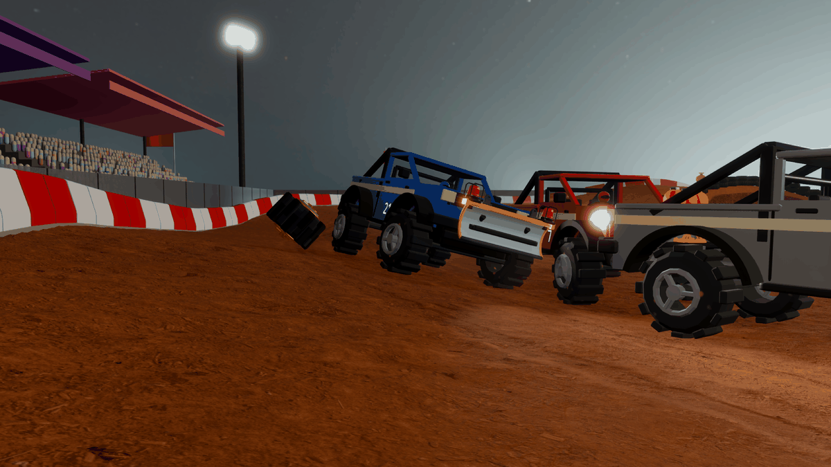 A truck racing through a floodlit stadium at night
